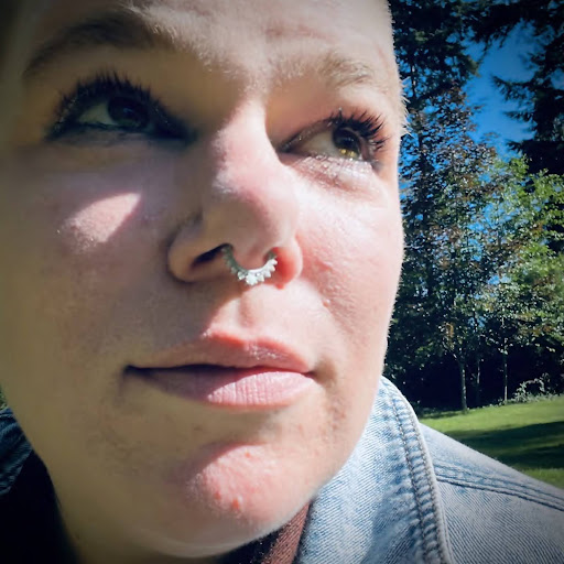 Selfie of author of website wearing septum ring and jean jacket